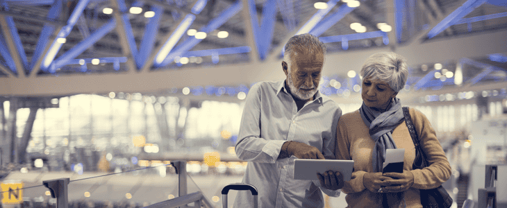 Elderly couple navigating airport